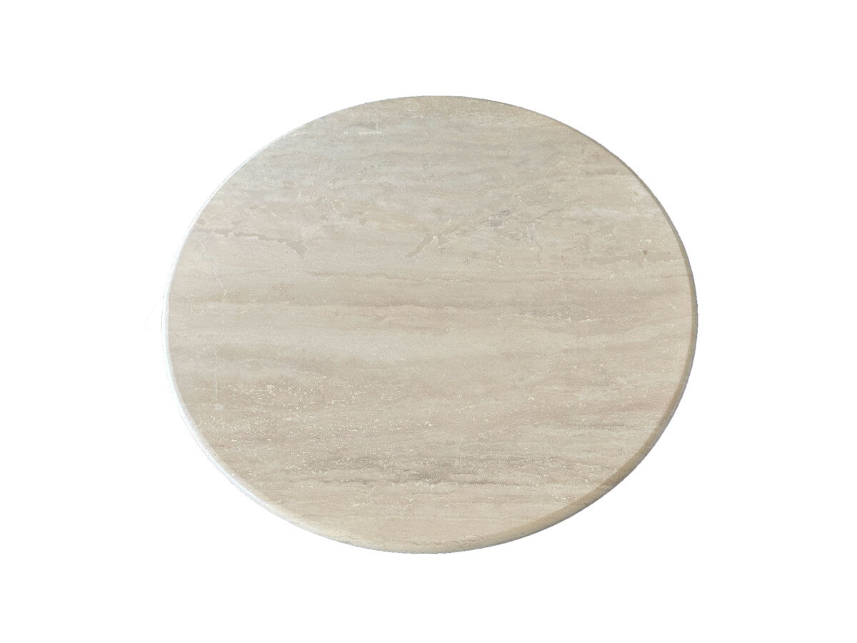Round travertine dining table with a smooth beige surface and a cylindrical pedestal base, evoking a minimalist and elegant design.
